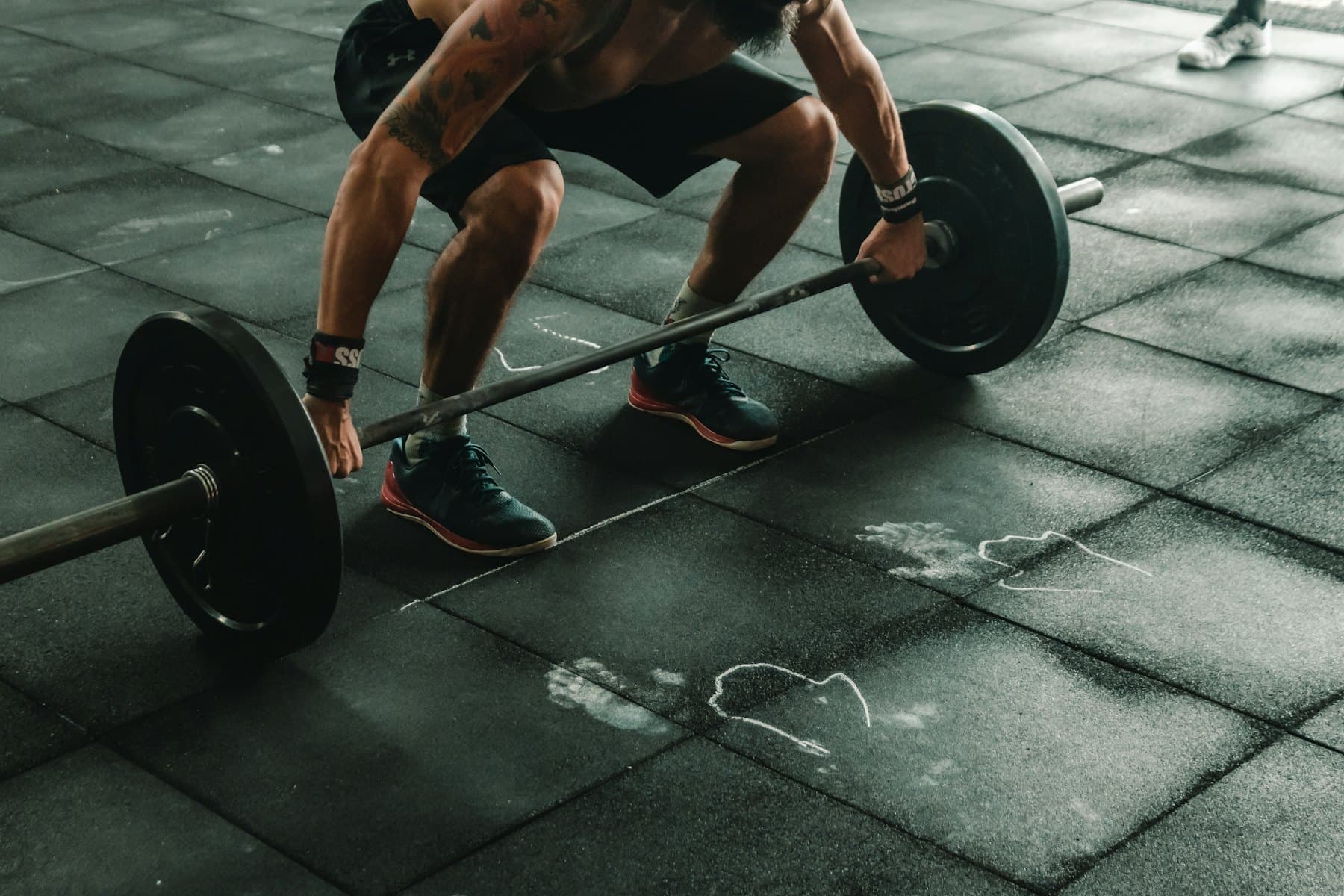 A lifter mid-pull on a loaded barbell